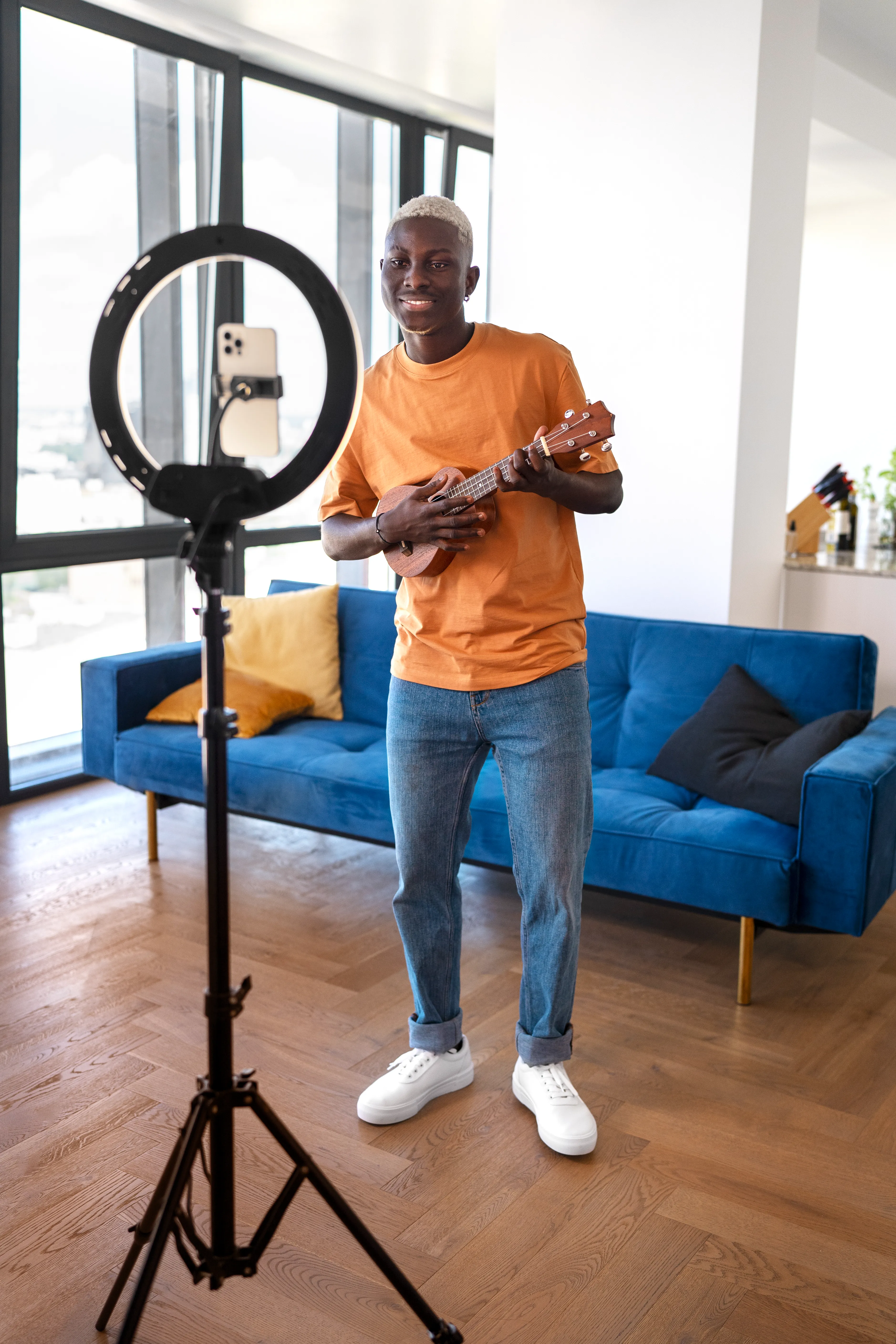 Teen creator with ukulele making content